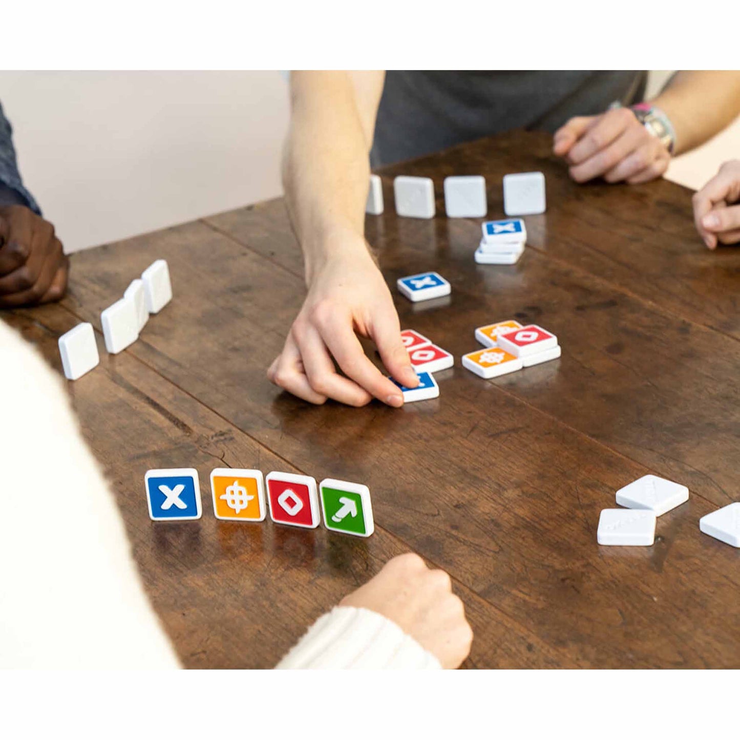 Photo of adults hands playing Trixo by FlexIQ.