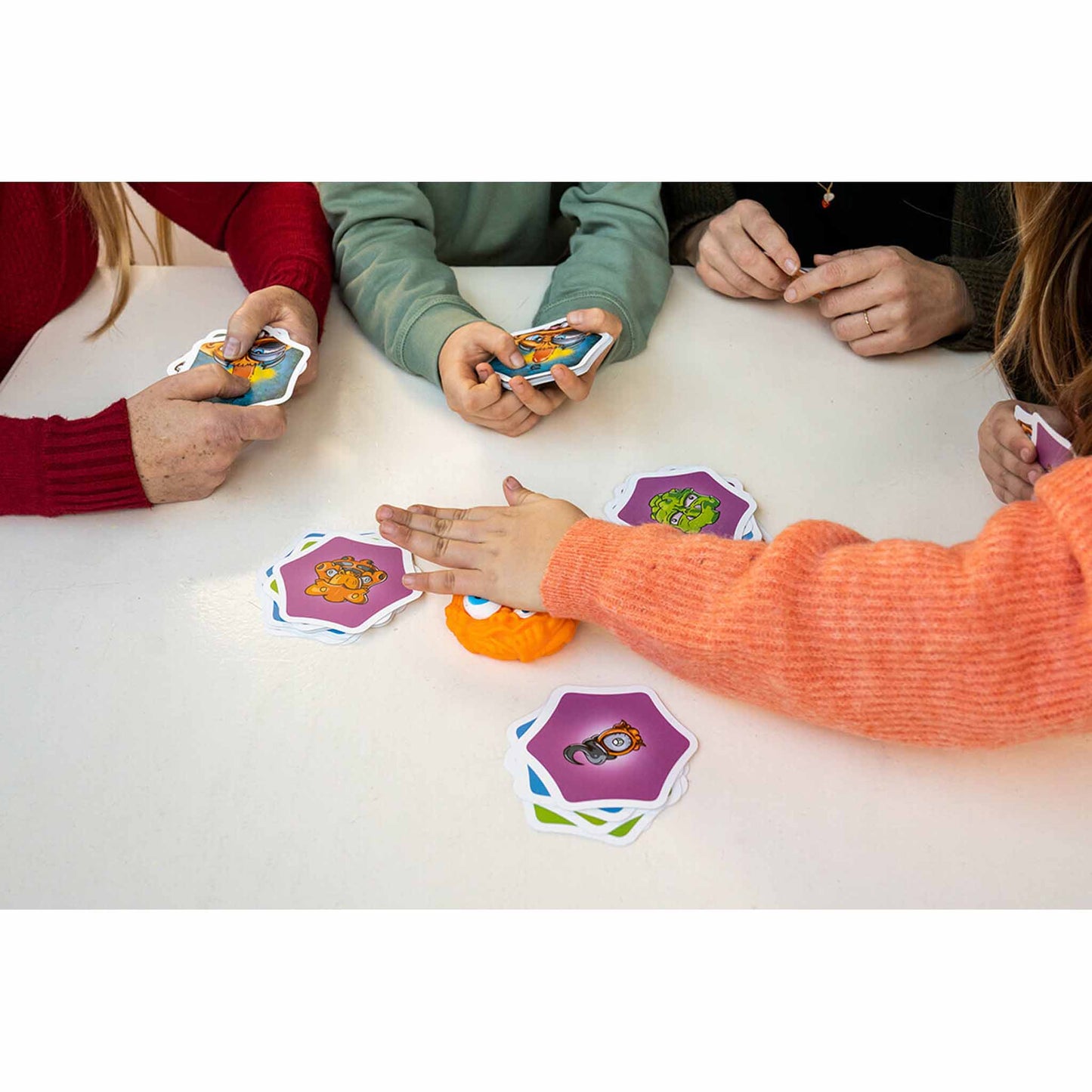 Closeup photo of hands playing Monster Mash game by FLEXIQ.