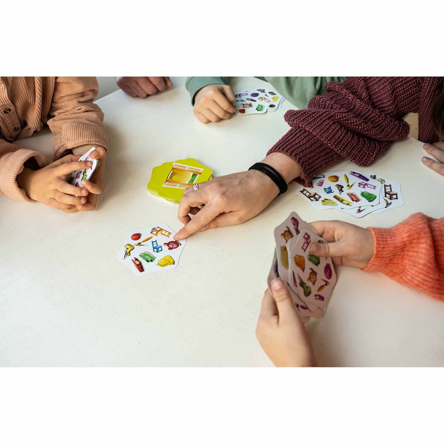 Close up photo of hands playing Switch It! flexible thinking game by FLEXIQ.